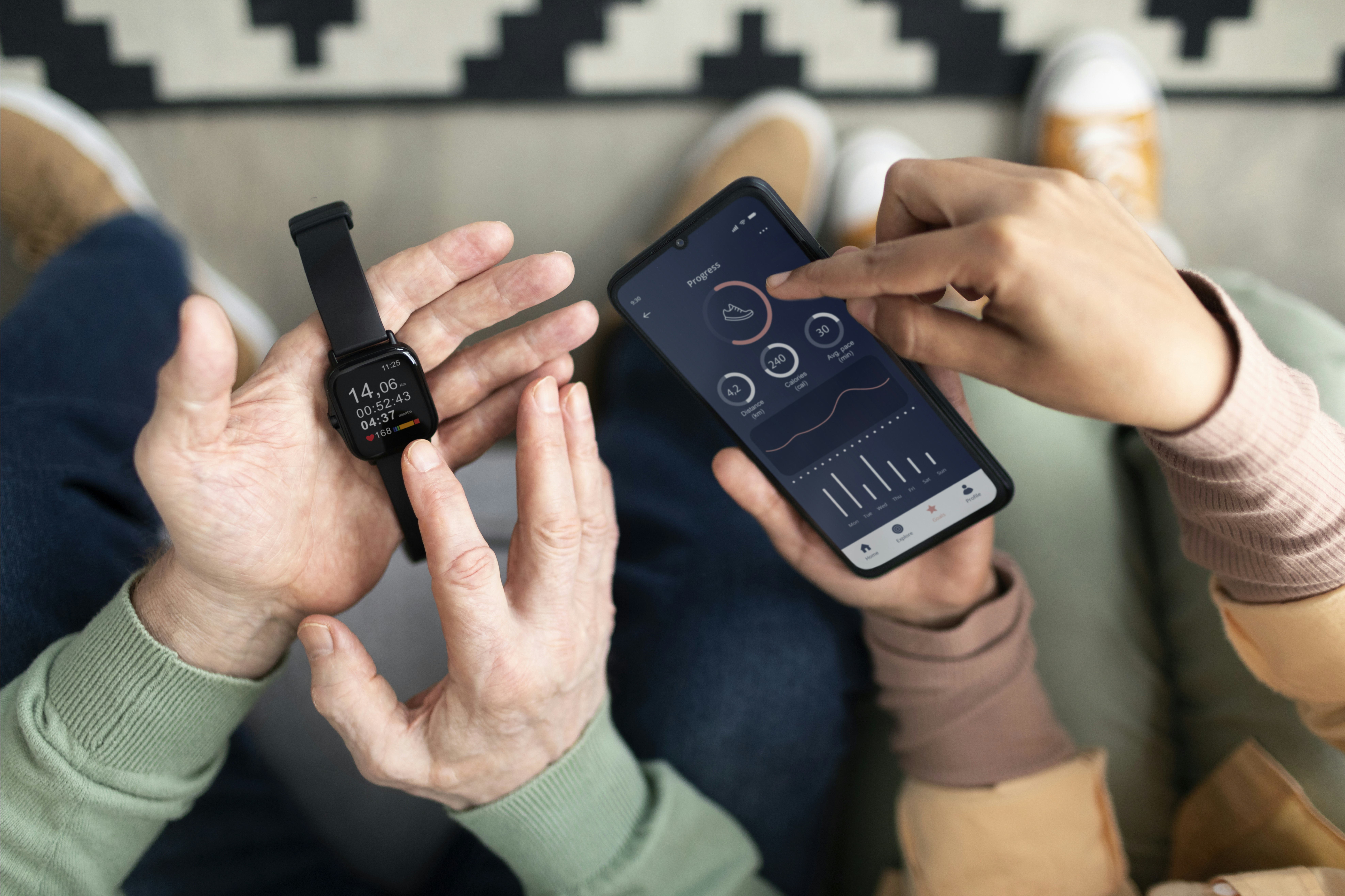 arabic-woman-teaching-senior-man-use-smartwatch-with-smartphone
